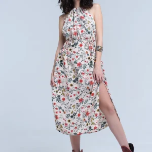 Vestido midi floral beige con cuello alto y aberturas